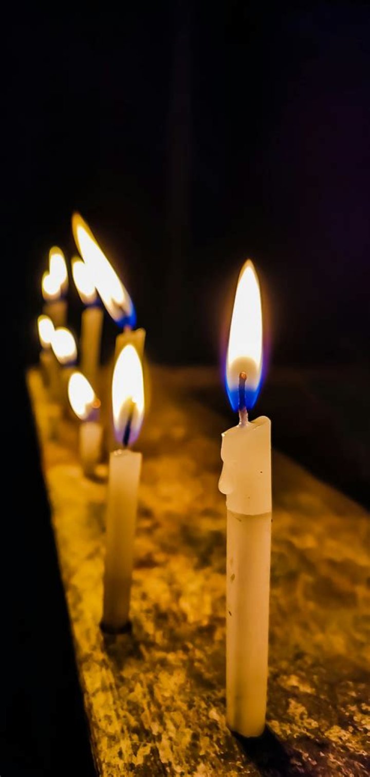 Candles are lit during a fan-created memorial for the late Chester Bennington, the lead singer of the popular punk band Linkin Park, at the Boston ...