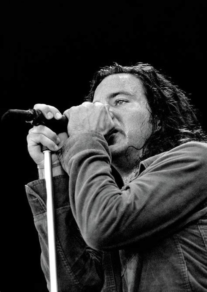 Eddie Vedder singing and playing guitar