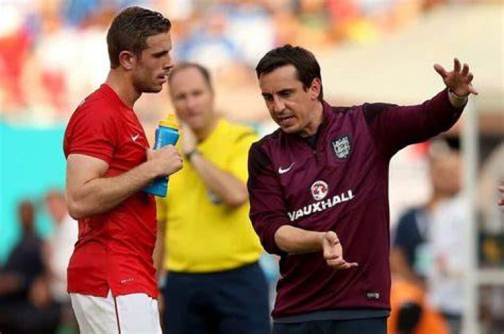 Gary Neville photographed while coaching a player.