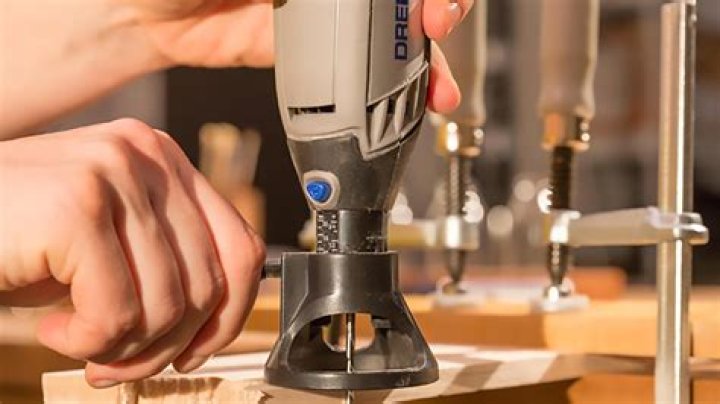 How do you attach a Dremel cutting tool?