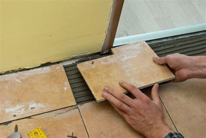 How do you cut tile around a door frame?