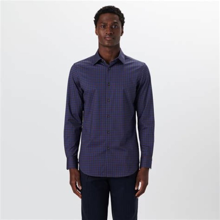 James wore a gingham shirt underneath his black suit