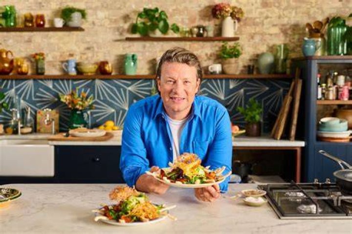 Jamie Oliver with his car.