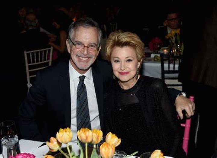 Jane and her husband, Garry smiling towards camera