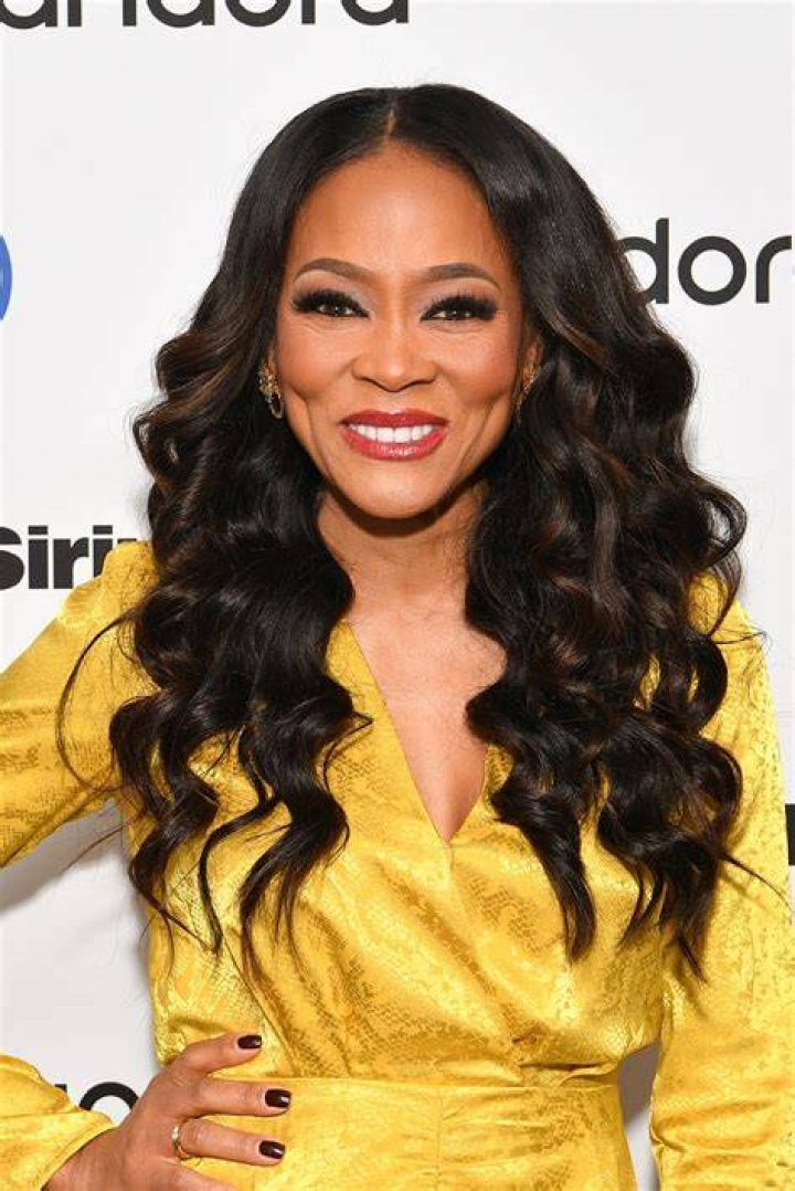 Robin Givens in a yellow dress smiling on the left photo and her husband in a white shirt and black pants in the right photo.