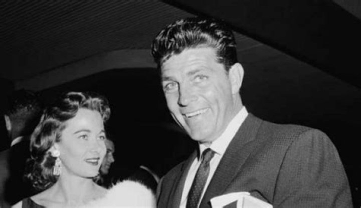 Susan Dee Robbins and her late husband, Dale Robertson posing for a photo shoot.
