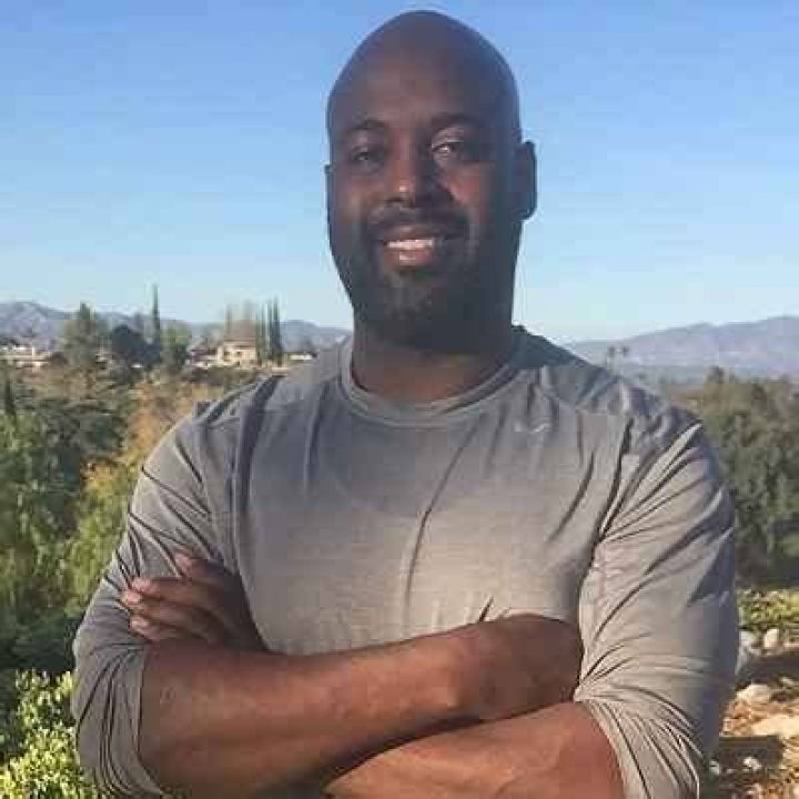 What does Carlos Woods do for a living?